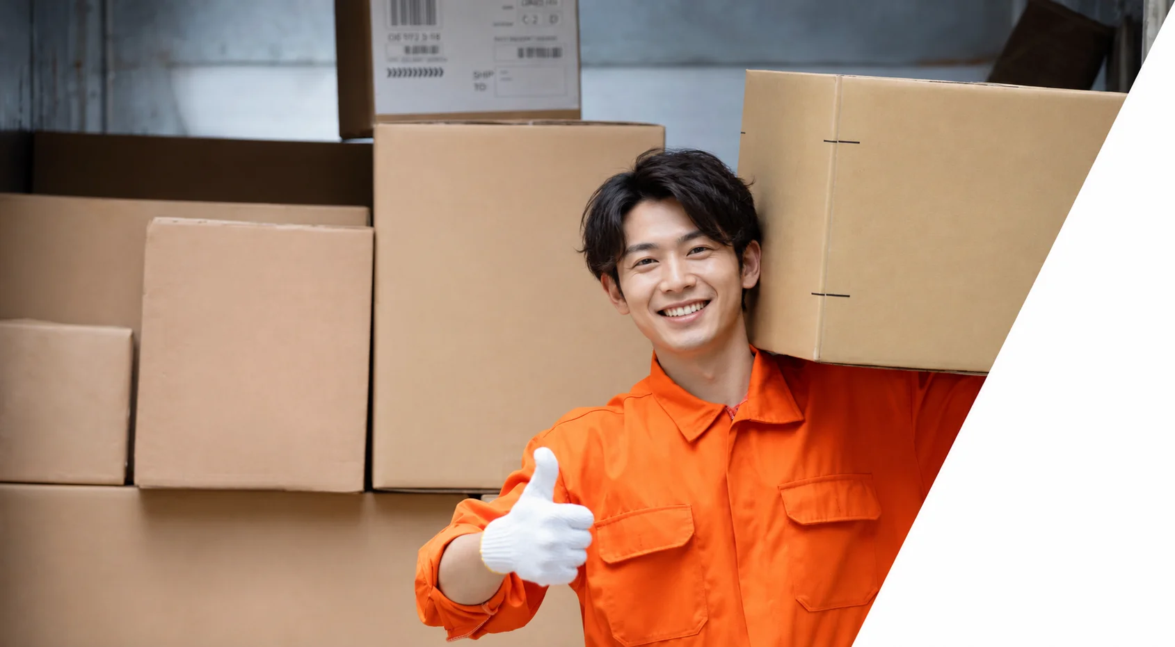 Fulfillment services Japan: warehouse worker handling packed shipping boxes ready for dispatch